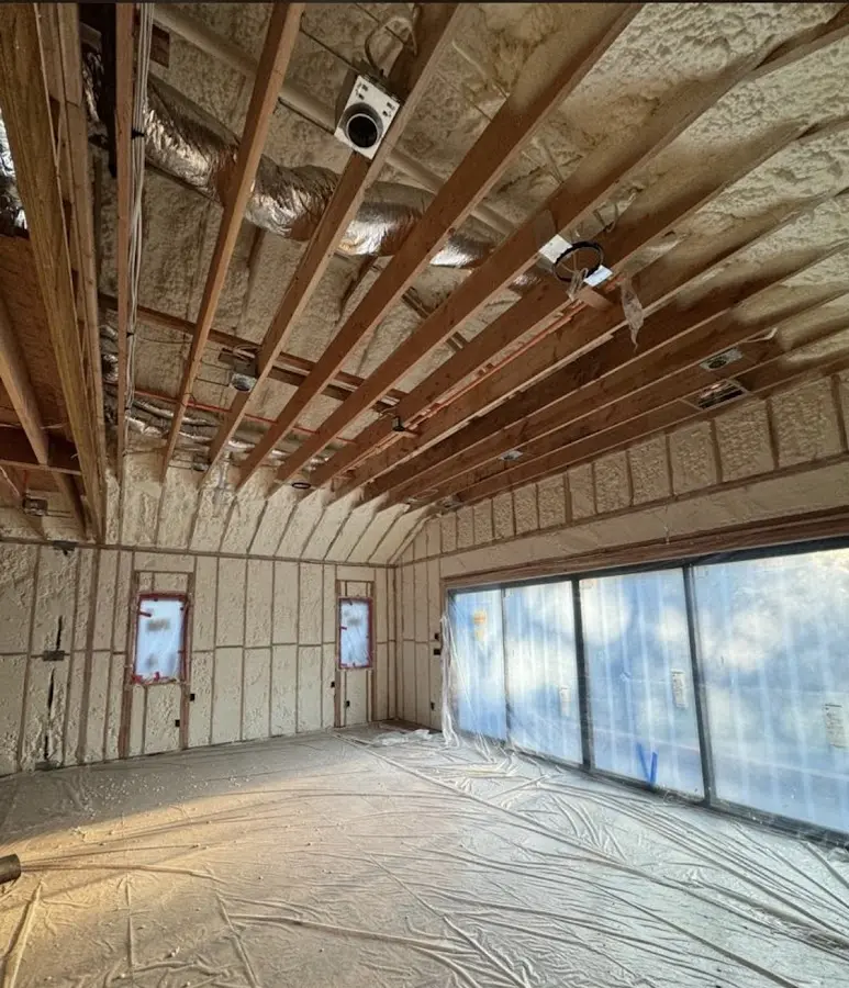 Interior walls and ceiling insulated with spray foam during new construction in Woodcliff Lake